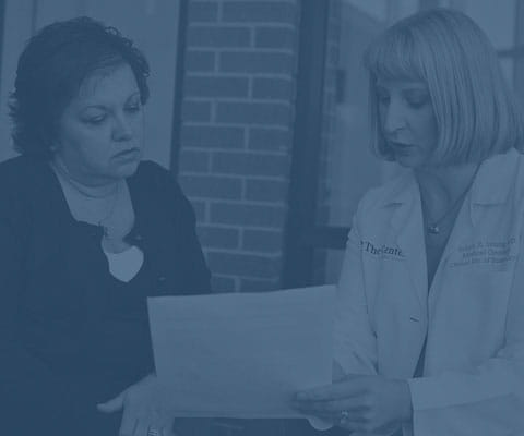 Blue transparent color over image of doctor and patient looking at information with the words Prepare for our appointment get questions to ask your doctor